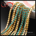 long decorative brass chain with blue zircon crystal
